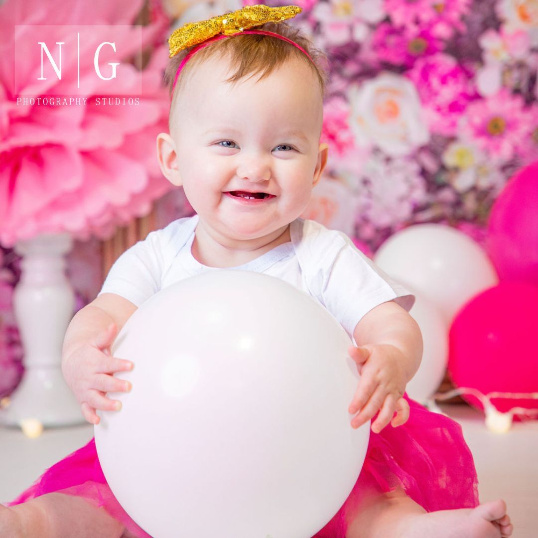 Series of pink floral photography studio scenes with white heart props.
