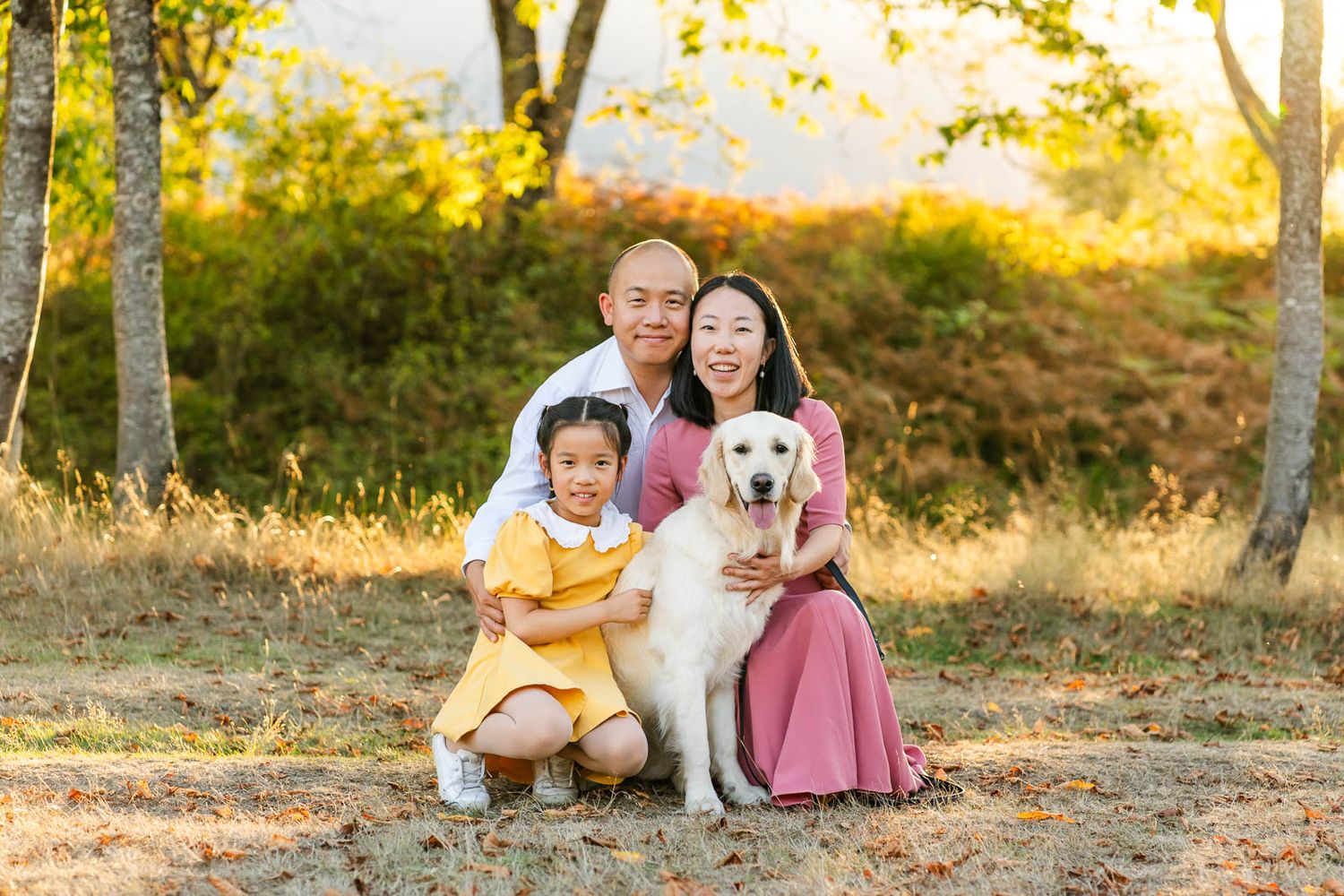 Family photo with golden retriever at sunset in North Bend.