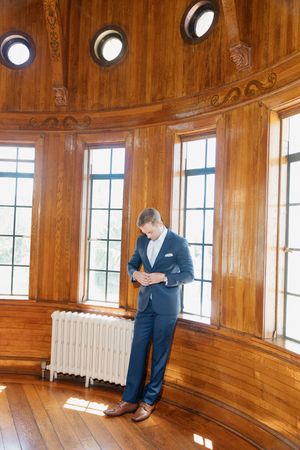 A sequence of images showing a person in a suit looking down at something in a wood-paneled room with windows.