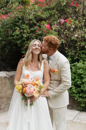 Romantic garden wedding sequence showing couple in white attire with coral and peach floral bouquet among blooming roses.