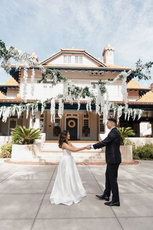 A sequence of wedding photos showing a couple dancing in front of a Spanish-style building with white columns.