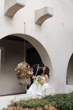 Spanish-style white archways and courtyard creating an elegant wedding venue backdrop.