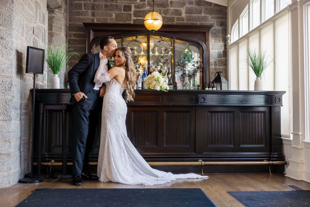 Elegant rustic venue with exposed brick walls, large windows and hardwood floors creates romantic wedding ambiance.