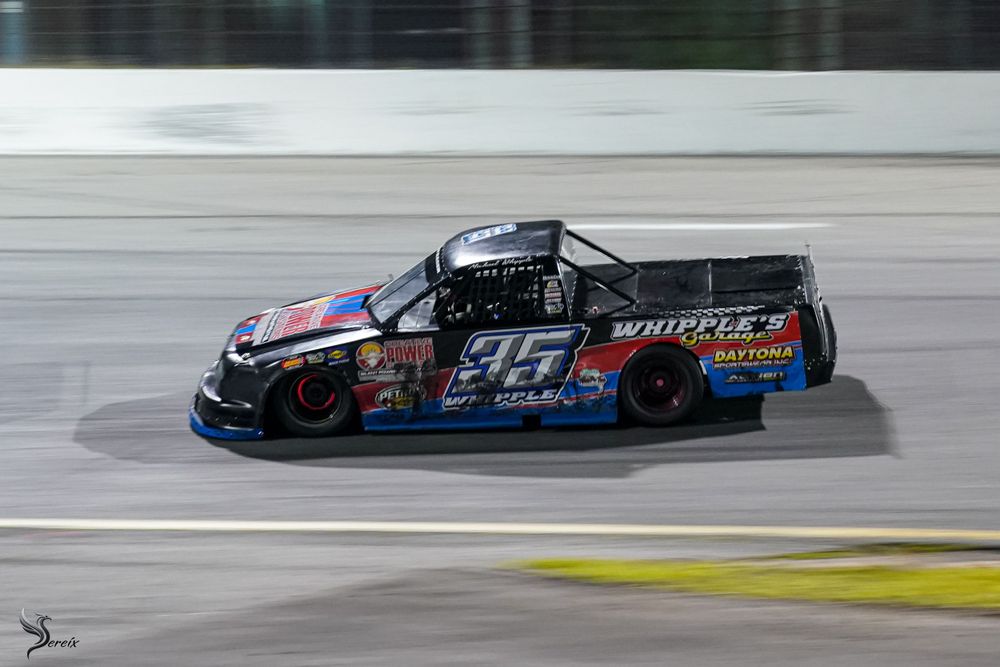 High-speed race car cornering on track during auto racing event, dynamic motorsports branding photo by SRX Media Group