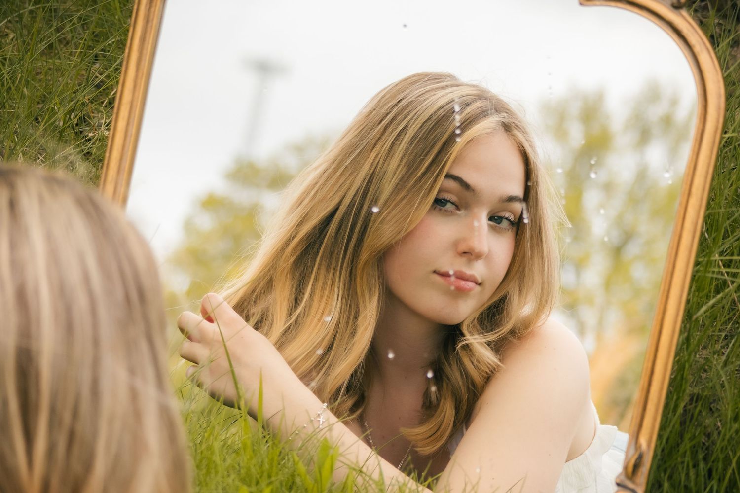 Outdoor spring senior photos in field in Springfield, Illinois