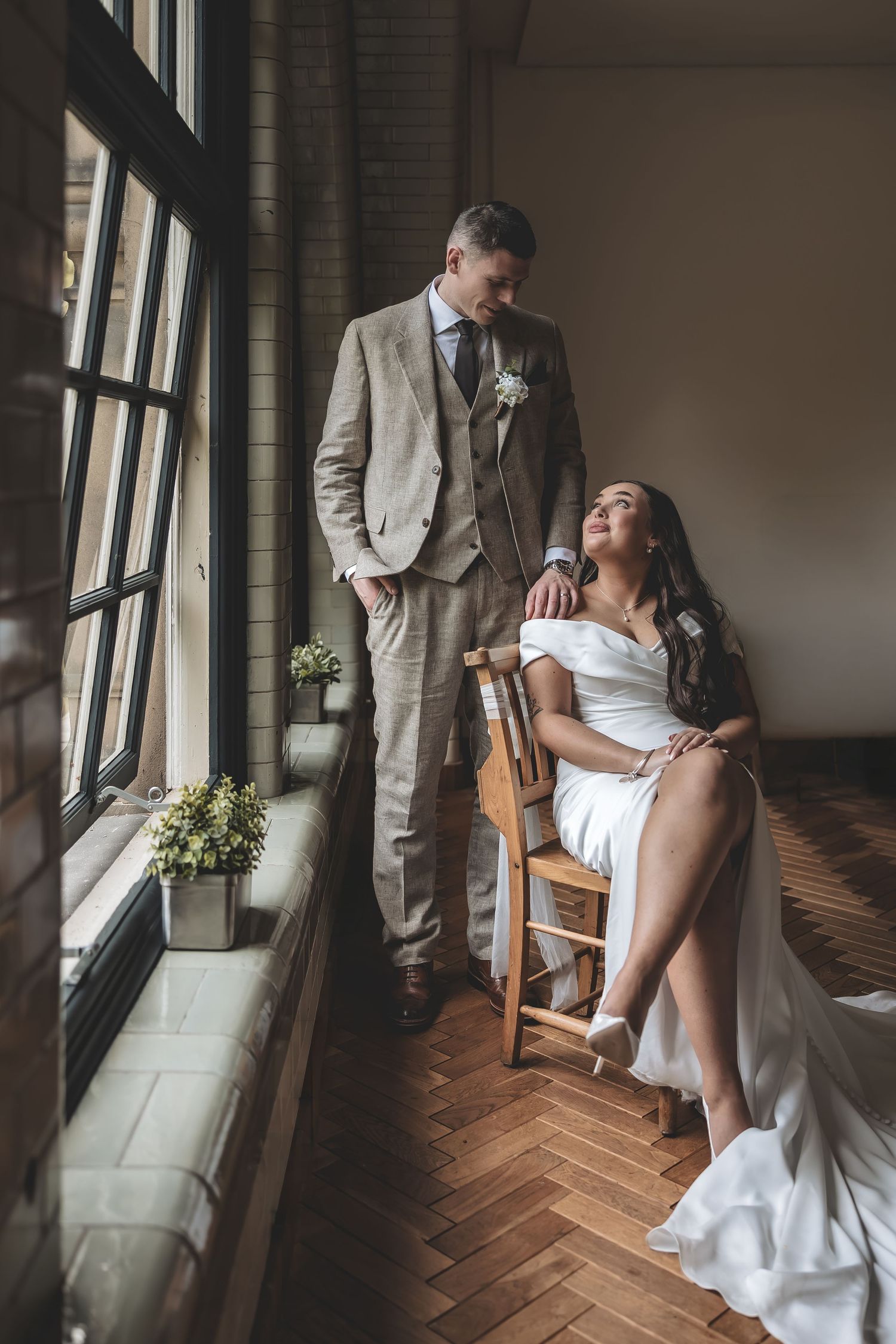 A Relaxed couple portrait using natural window light at a Nottinghamshire wedding venue.