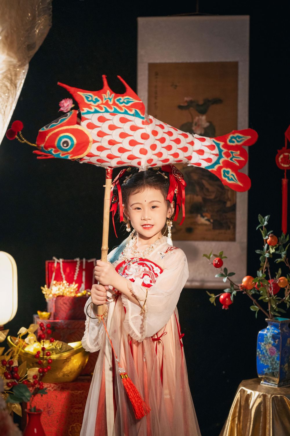 Cute children's studio portrait in an elegant Tang Dynasty Hanfu with dazzling golden props, by Imagine Image Studio.