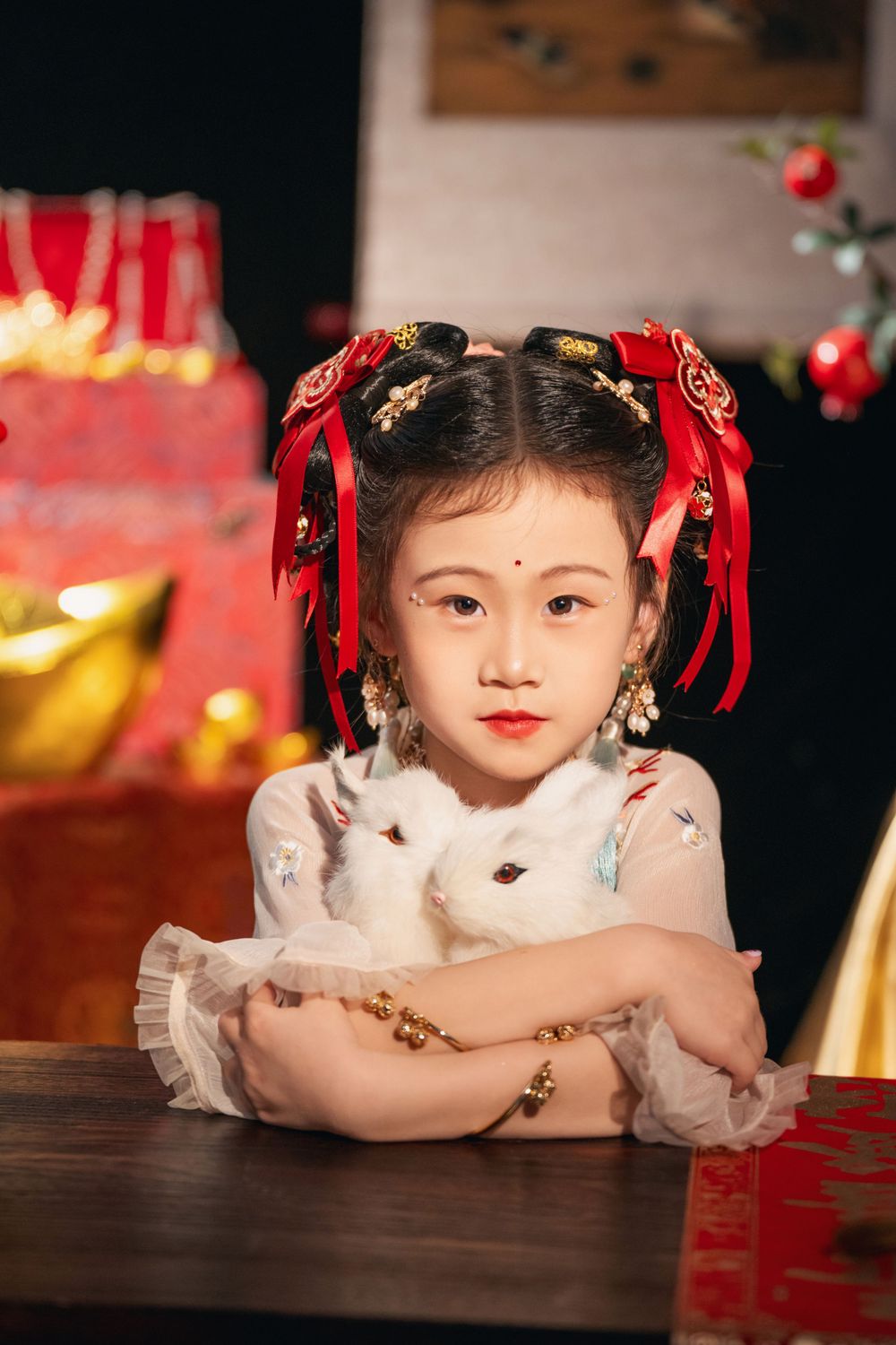 Cute children's studio portrait in an elegant Tang Dynasty Hanfu with dazzling golden props, by Imagine Image Studio.