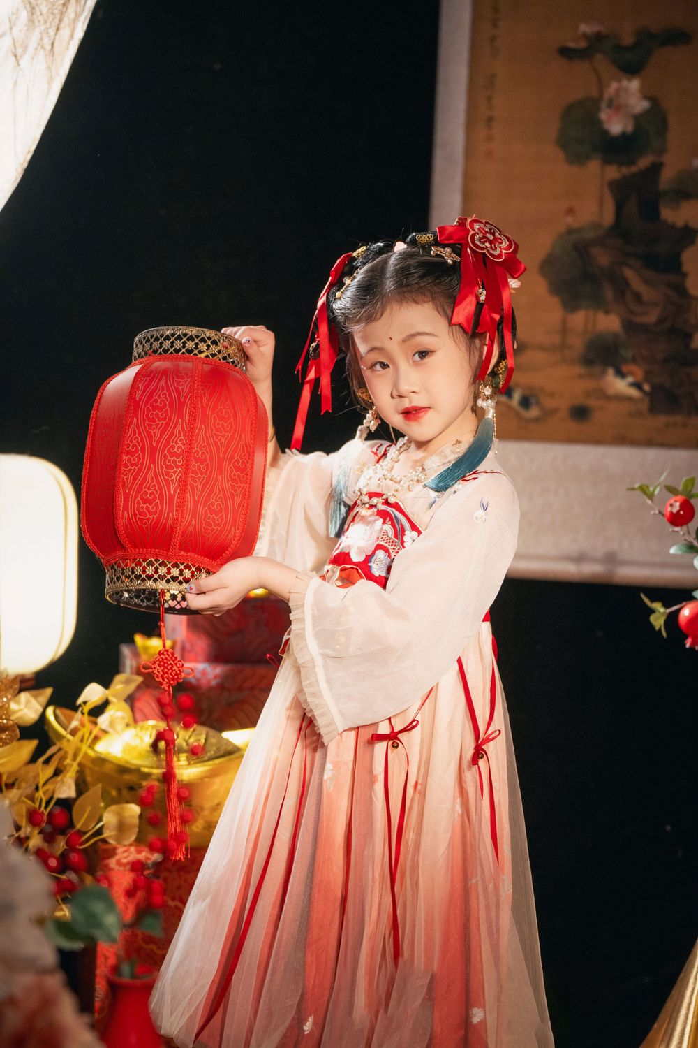 Cute children's studio portrait in an elegant Tang Dynasty Hanfu with dazzling golden props, by Imagine Image Studio.