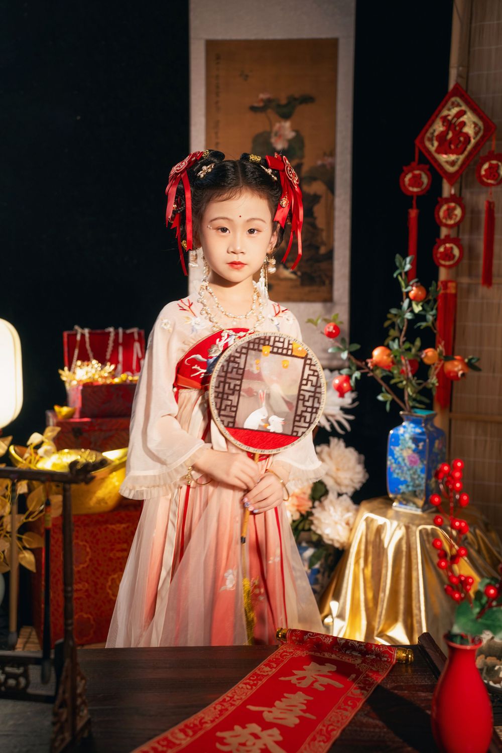 Cute children's studio portrait in an elegant Tang Dynasty Hanfu with dazzling golden props, by Imagine Image Studio.