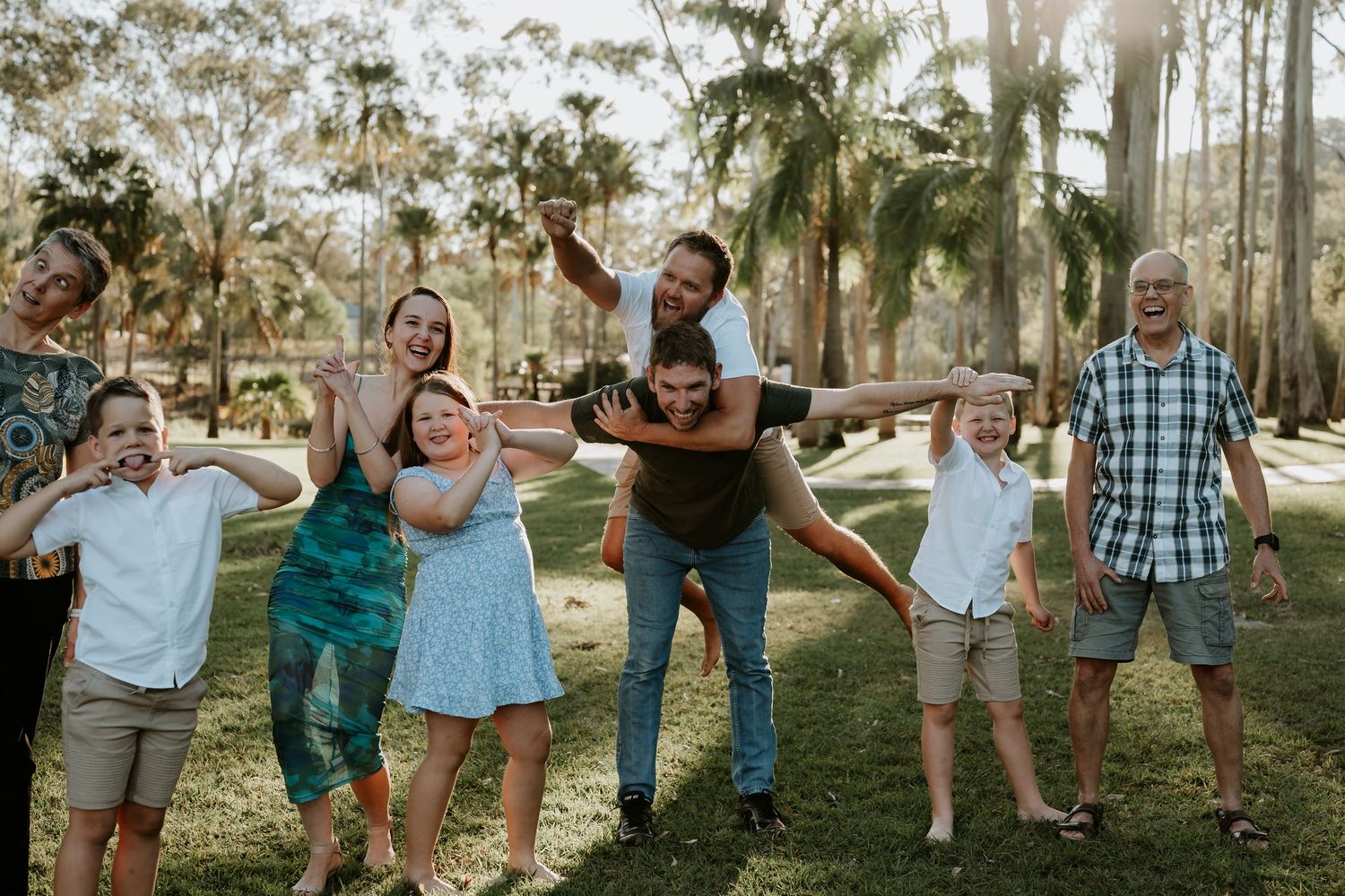 A series of candid outdoor family photos showing playful moments and laughter in a Gladstone garden setting at sunset.