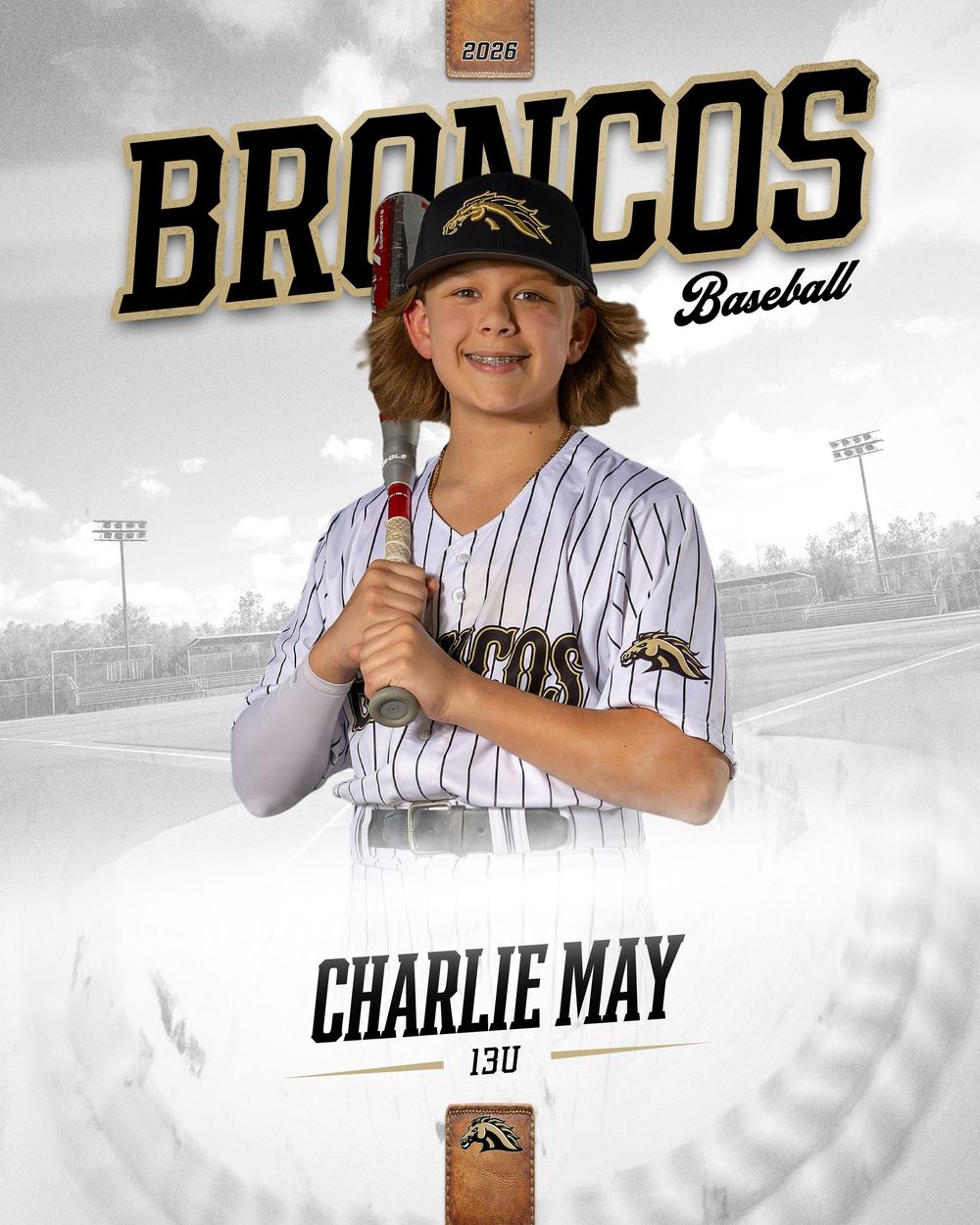 Charlie May, 13U Broncos Baseball player, poses with a bat in a pinstripe uniform for a 2025 team photo.