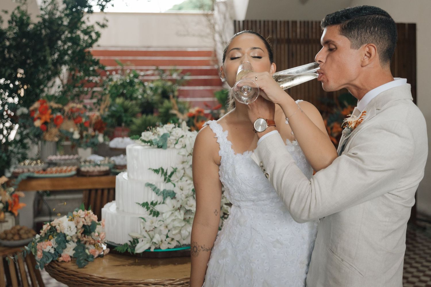 Wedding couple participating in the traditional cake feeding ceremony.