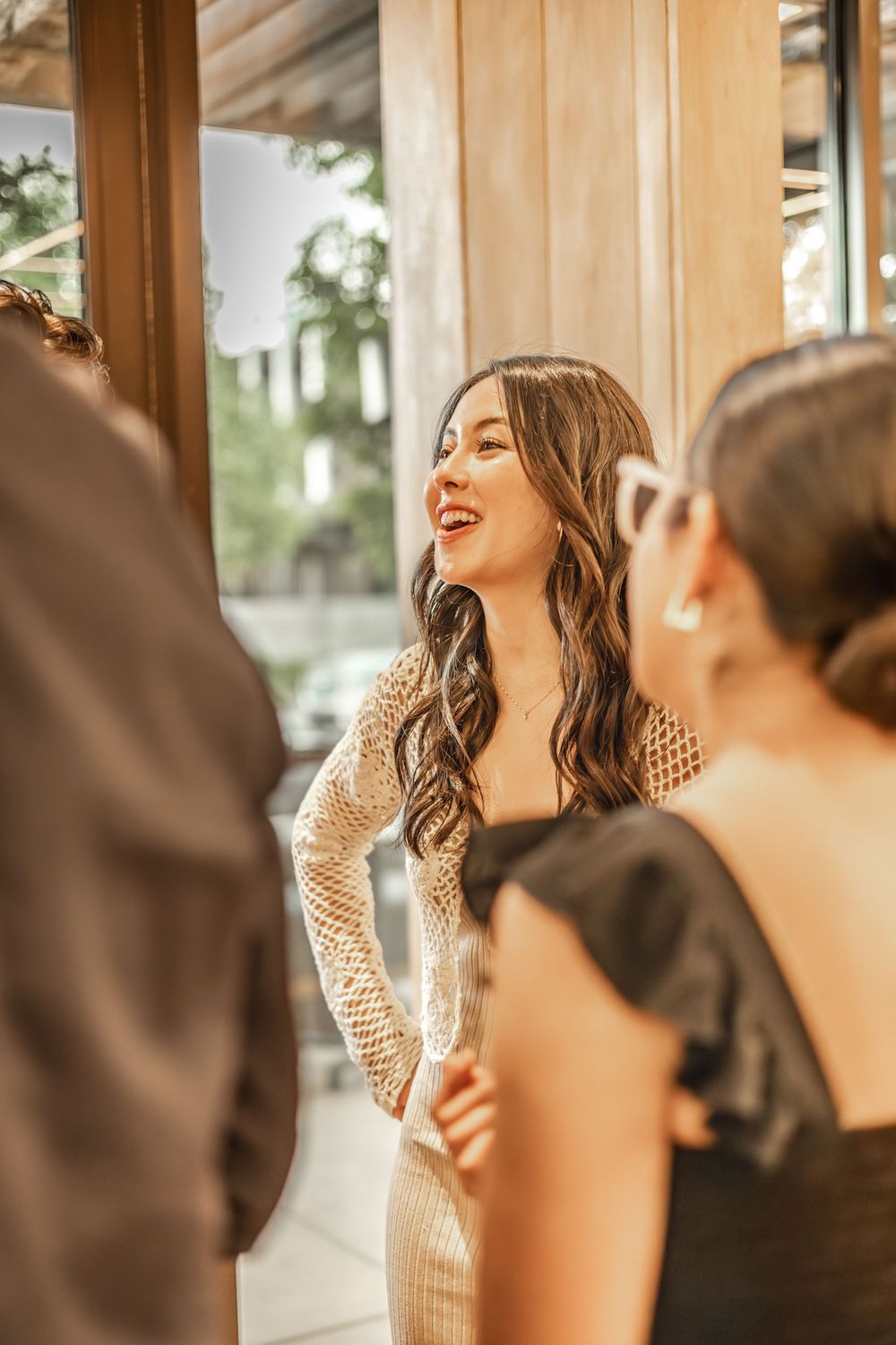 Surprise Engagement Bride-to-be laughing with loved ones