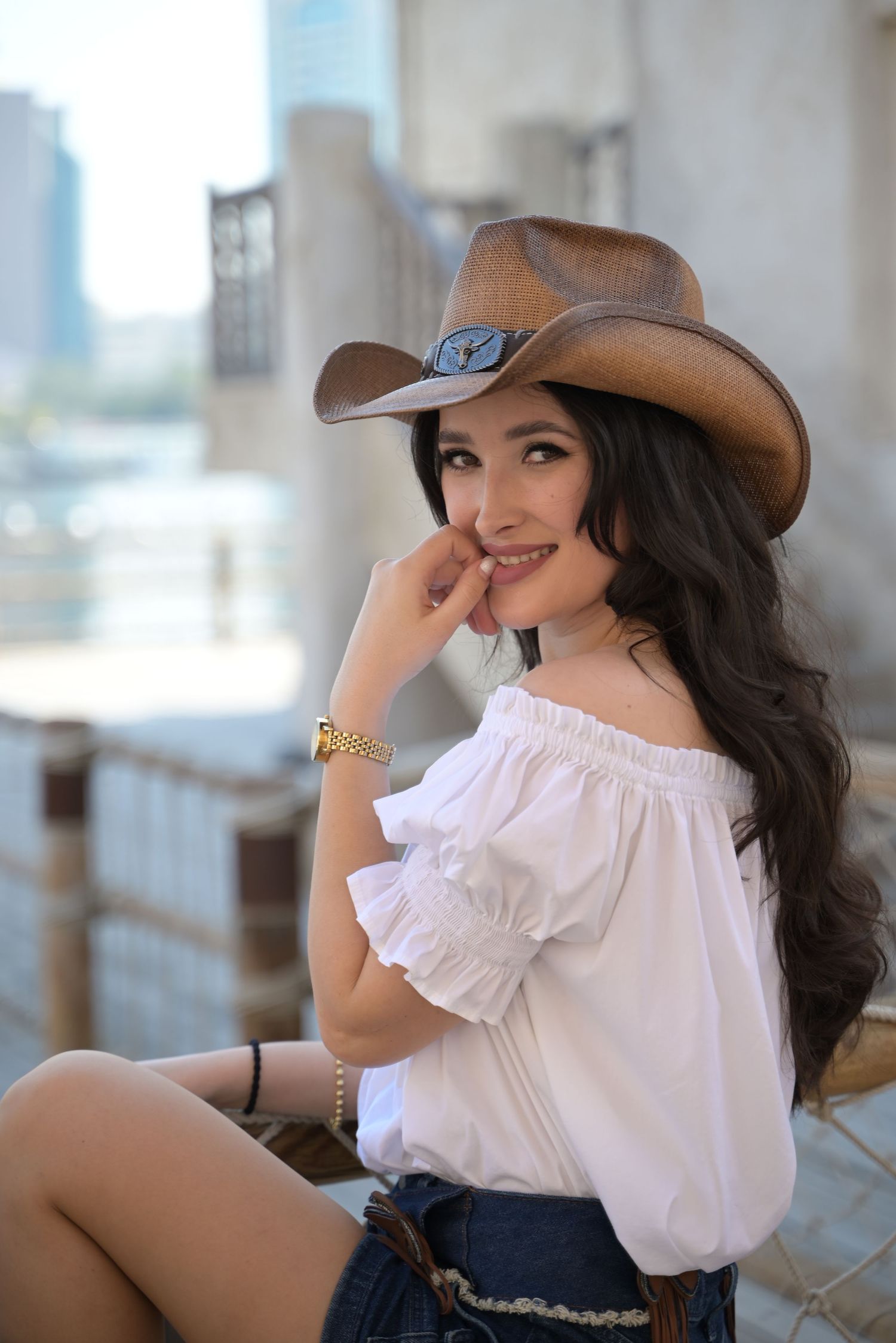 An adventurous young woman in a stylish cowboy hat