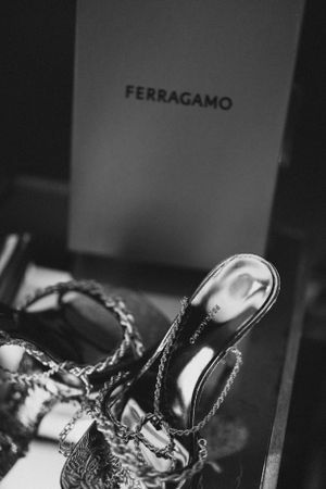 Black and white photo of Ferragamo shoes in their branded box.