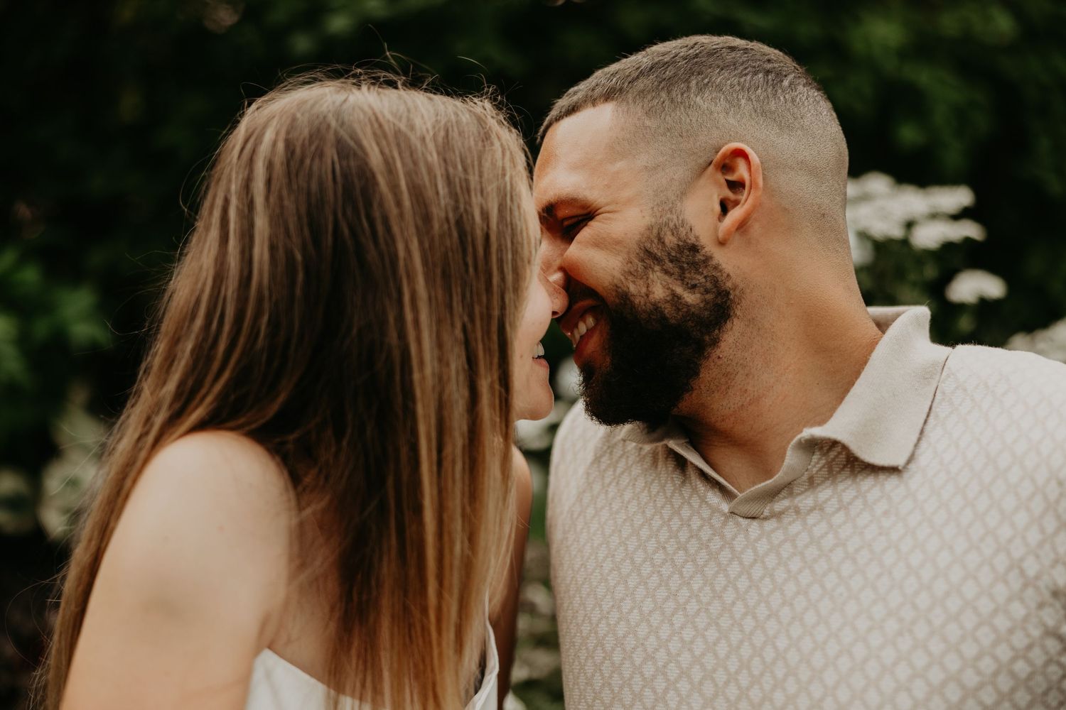 An intimate close-up photo sequence of a couple sharing tender moments outdoors.