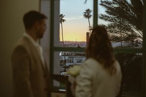 Sunset silhouettes with palm trees create a romantic ambiance.