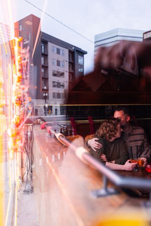 Salt Lake City Utah Photographer, candid relaxed couple on a date night at a bar downtown