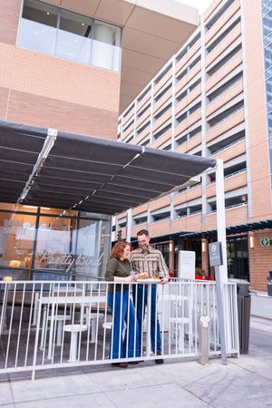 Salt Lake City Utah Photographer, candid relaxed couple on a date night at a diner with burgers and fries downtown