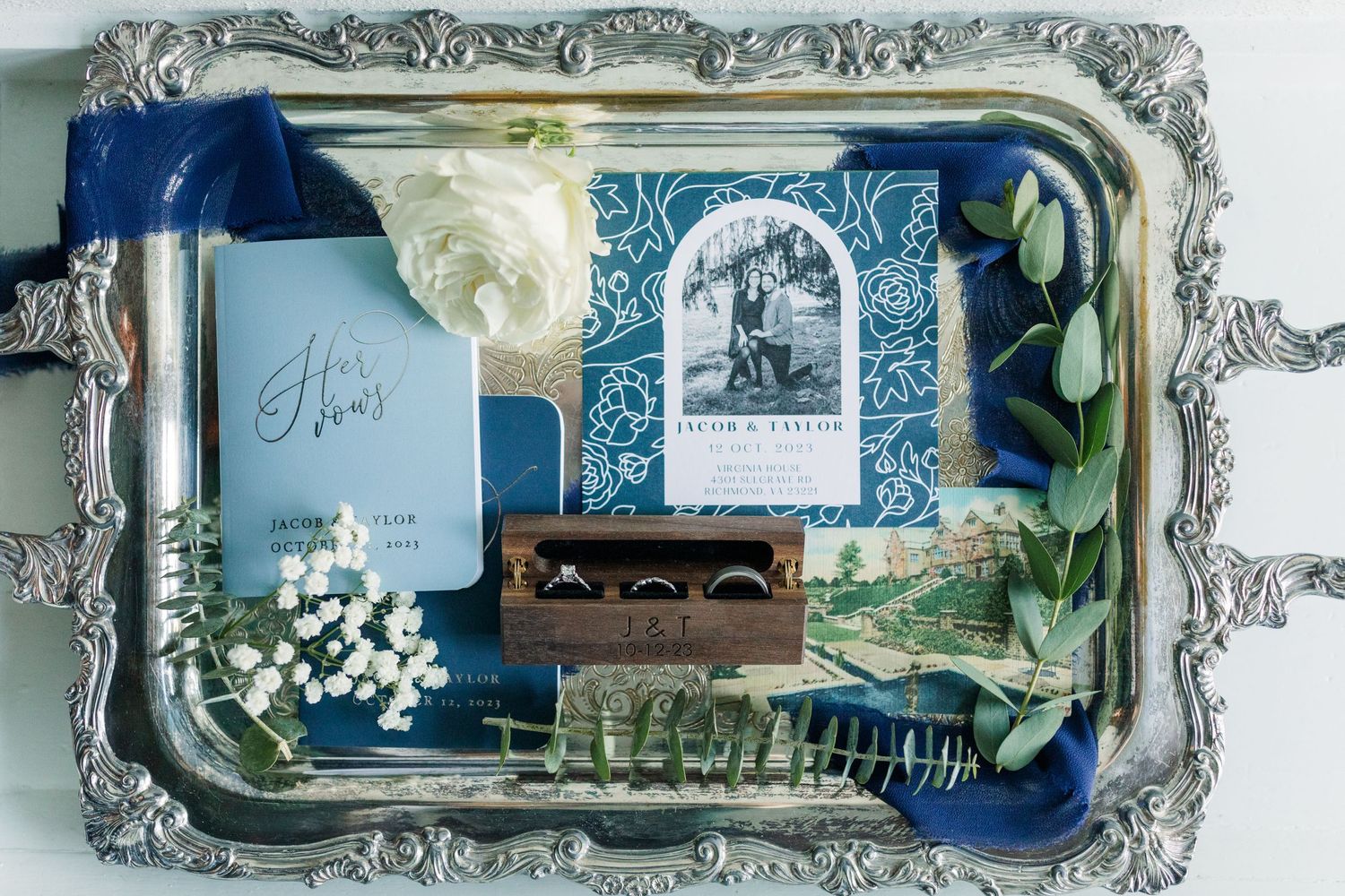 Wedding details with invitations, rings, and greenery at the Virginia House in Richmond, VA.