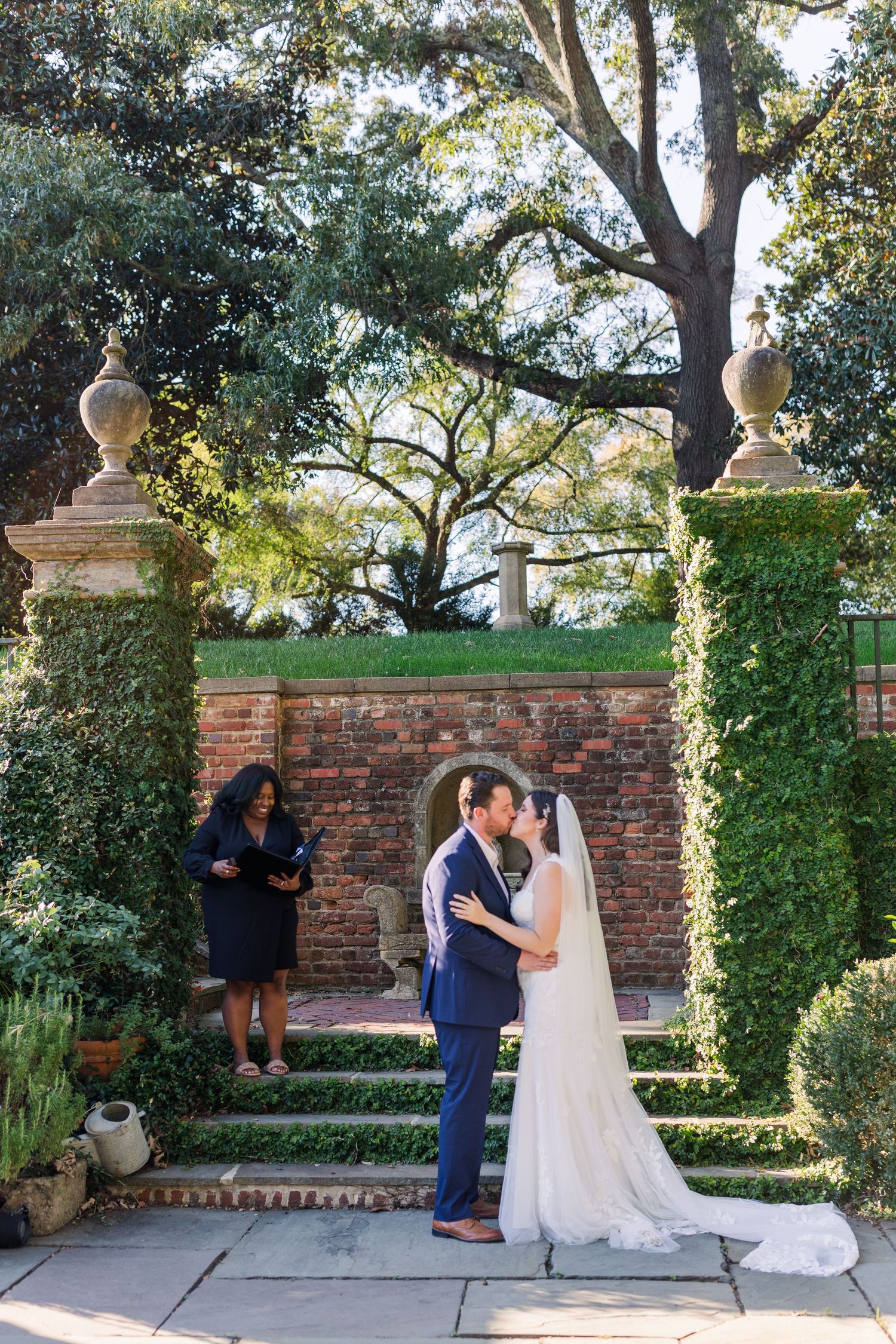 A bride and groom share their first kiss at the Virginia House in Richmond, VA.