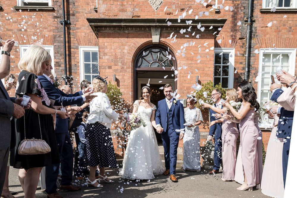 Guests throwing confettiat Kelham House.