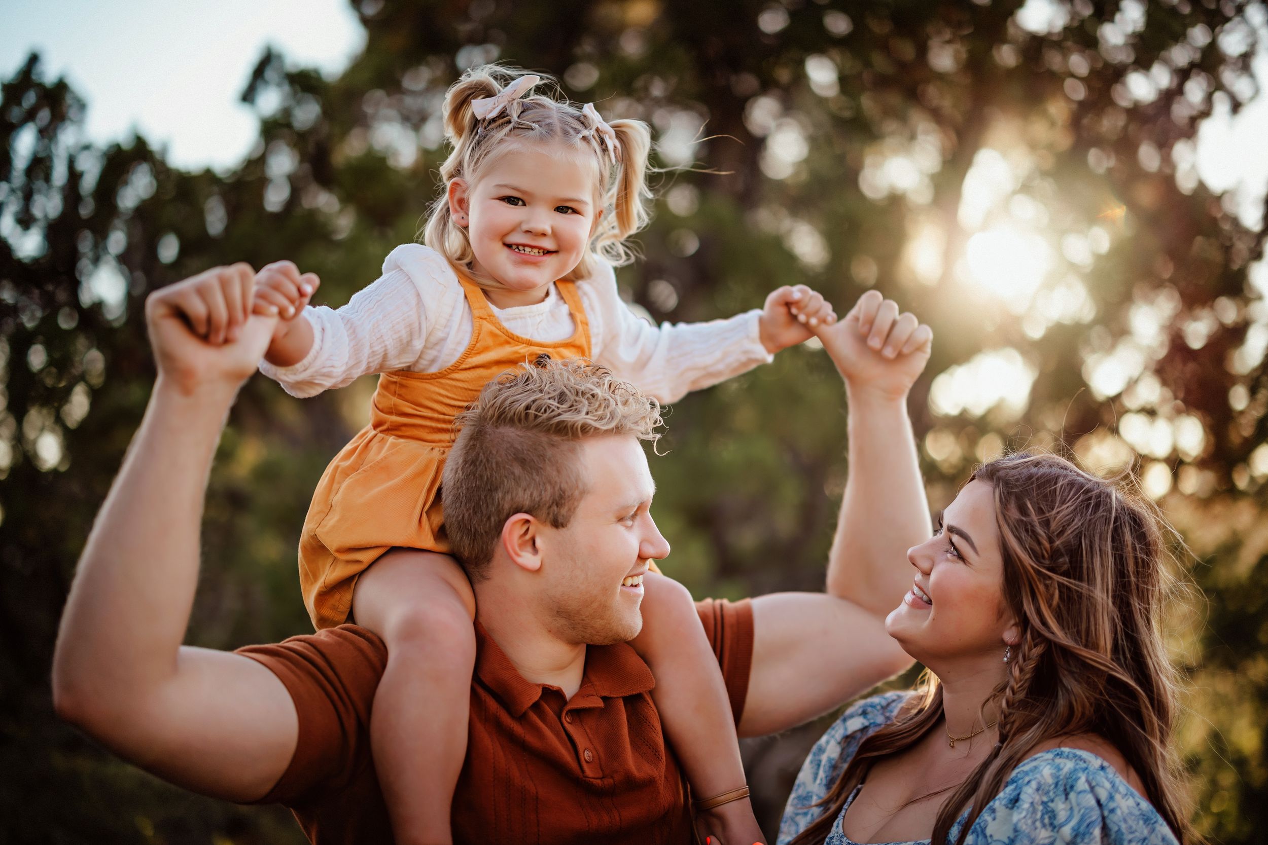 A joyful moment captured between family members in golden evening light near Pine Valley Utah, Southern Utah