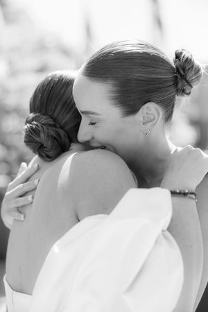 A romantic close-up sequence of a tender kiss captured in black and white photography.