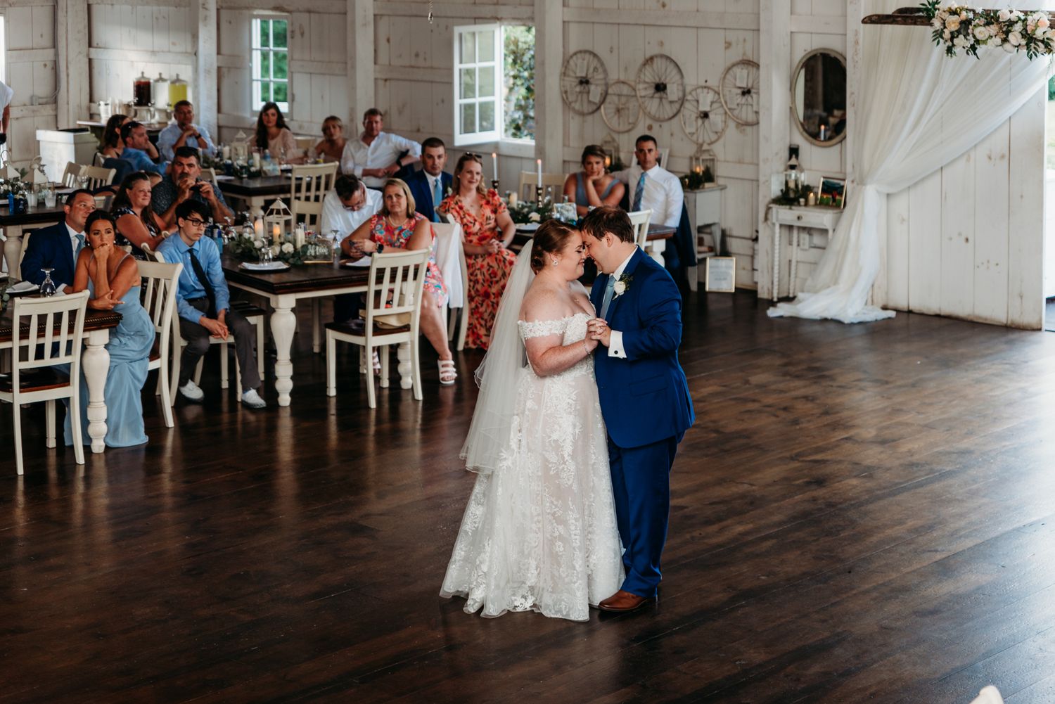 Bride and groom share their first dance at The White Barn at Lucas Farms