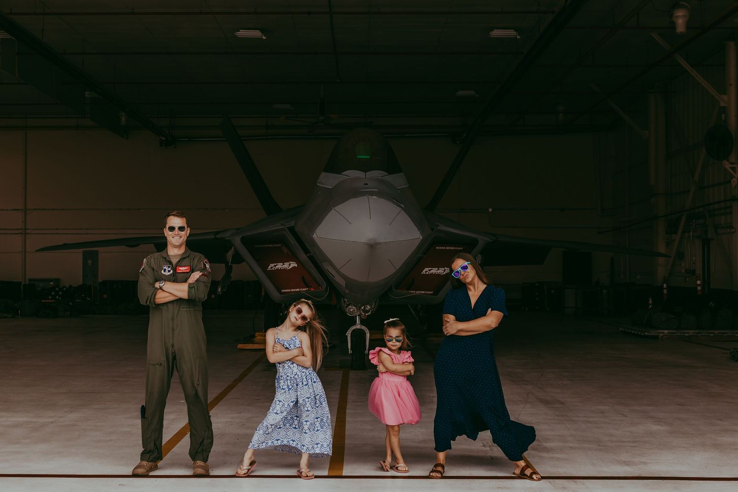 Military family in front of jet with sunglasses on. Whitney Popp, Arizona photographer.