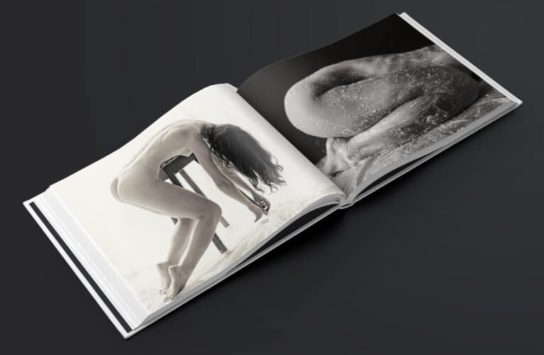 Black and white art photography book spread showing dramatic abstract forms and shadows.