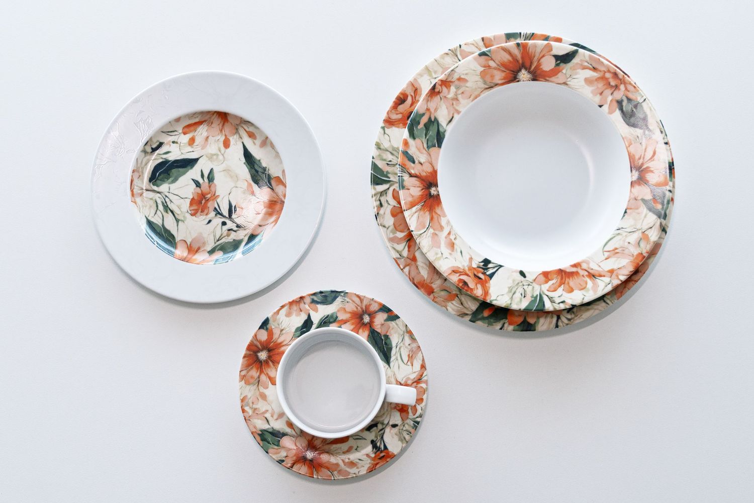 Porcelain collection Clematis with digital print, featuring vibrant orange flowers and green leaves.