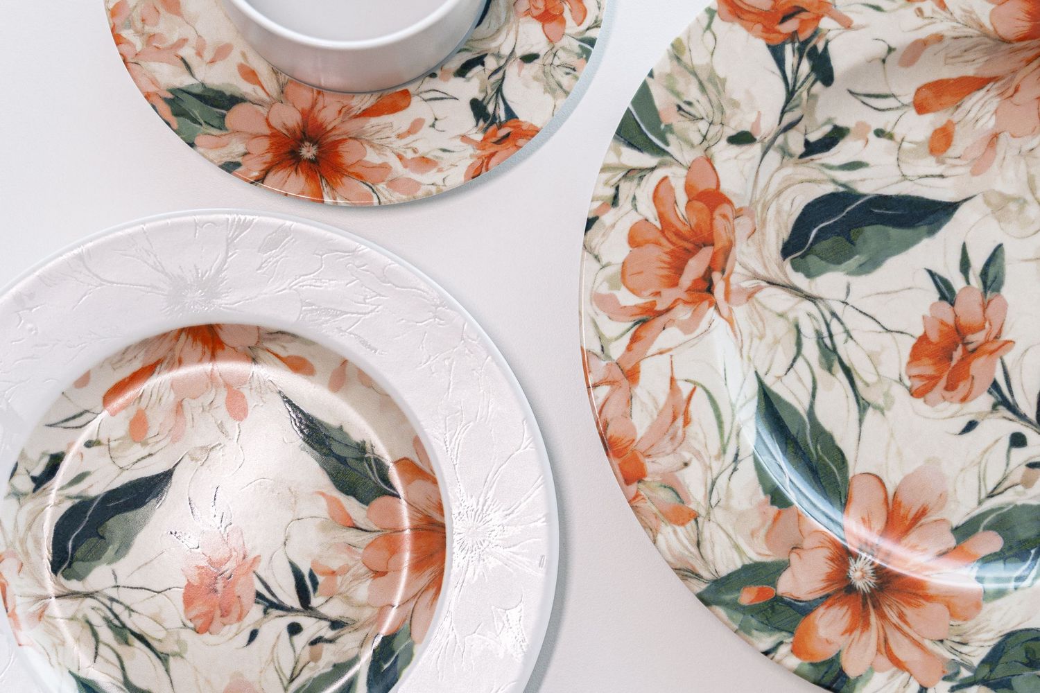 Porcelain collection Clematis with digital print, featuring vibrant orange flowers and green leaves.