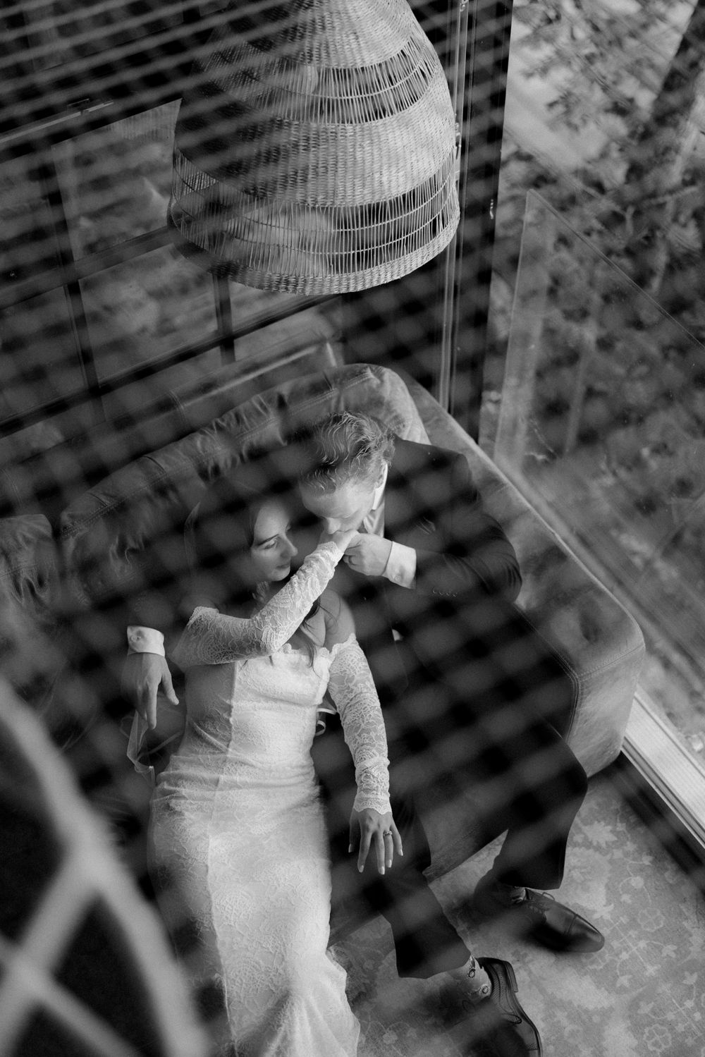 Black and white artistic photo showing multiple exposures through window blinds.