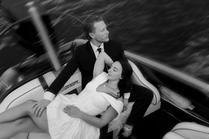 Artistic black and white sequence shows romantic boat ride for newlyweds.
