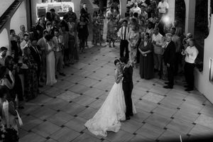 Overhead view of guests gathered in an elegant tiled reception venue.