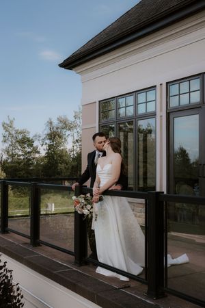 A series of romantic wedding photos captured on an elegant white building's deck.