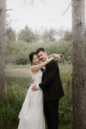 Romantic dance between trees captured in an ethereal forest wedding photoshoot.