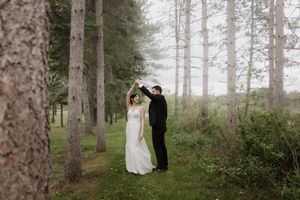 Wedding portraits captured in ethereal pine forest setting.