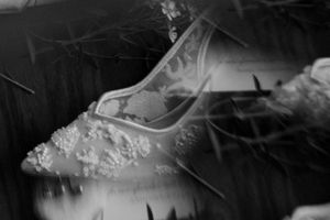 Ethereal black and white detail shots of bridal lace and veil.