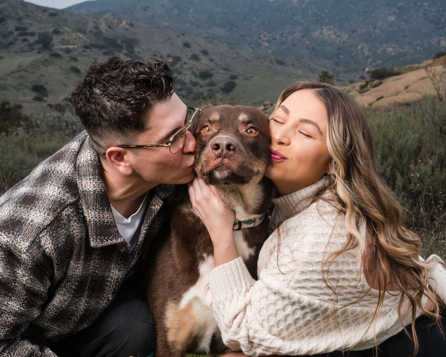 A romantic couple shares tender moments against a scenic mountain backdrop in a series of connected photos.