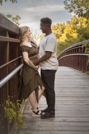 outdoor maternity session couple on bridge pregnancy photos