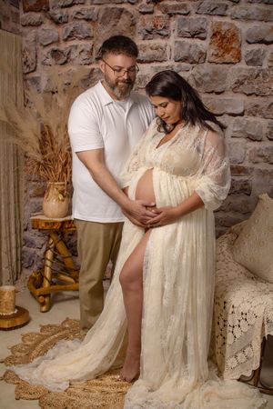 maternity photo with couple holding belly
