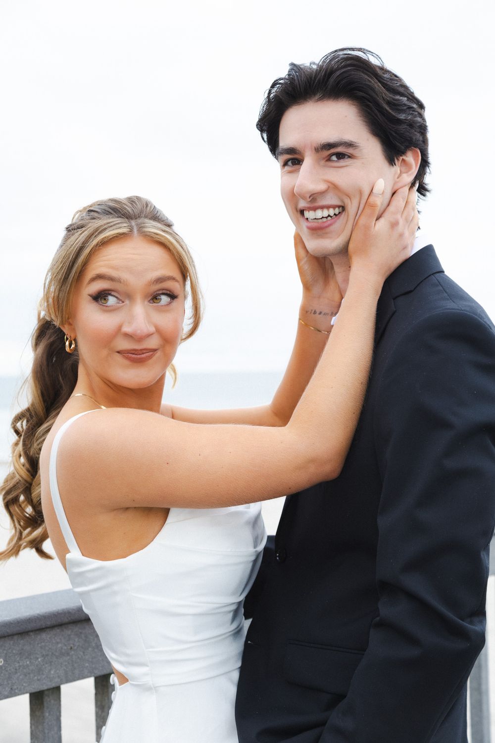 A bride and groom share a playful moment together in a series of candid wedding photos.