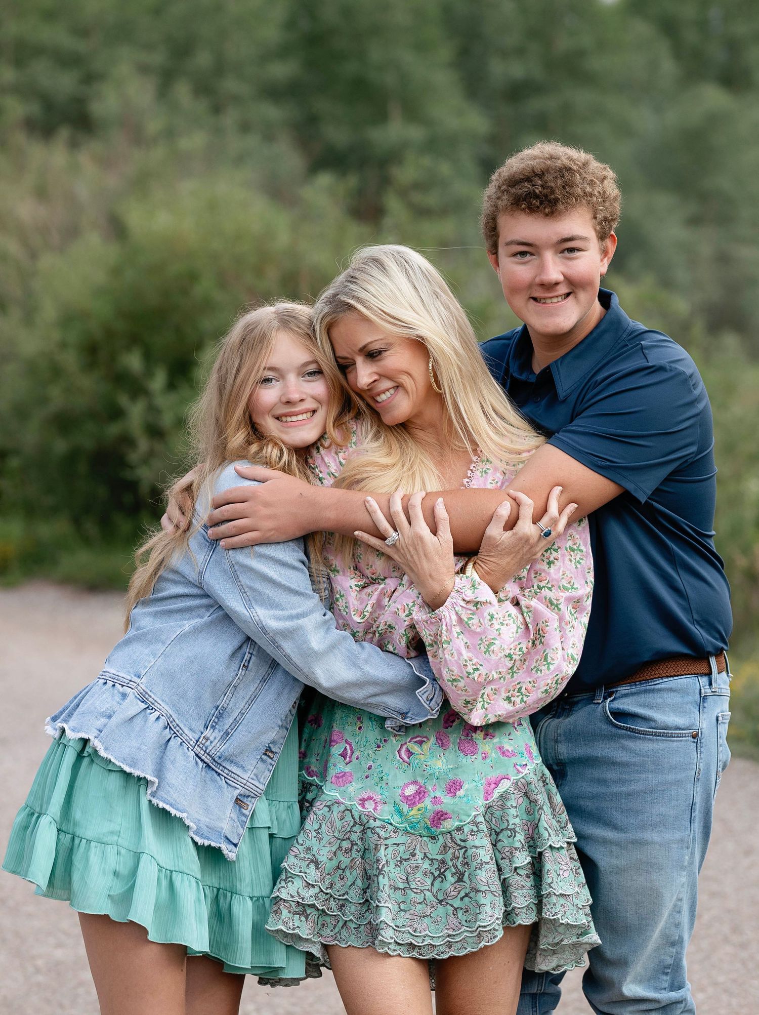 A sweet moment for this mother embracing her two children