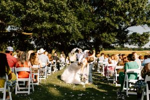 A couple pose walking down the isle on their wedding day in Eufaula, Oklahoma.