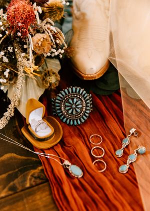A flatlay of details from a fall wedding day in Osage County, Oklahoma outside of Barnsdall after an EF4 tornado.