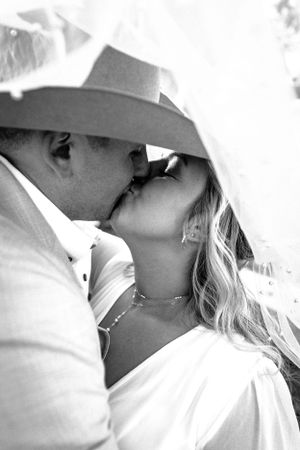 A couple pose for their wedding portraits on their wedding day in Claremore, Oklahoma.