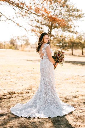 A bride poses for her bridal portraits on her wedding day in Osage County, Oklahoma outside of Barnsdall after an EF4 tornado.
